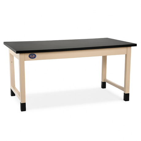 Heavy-duty industrial workbench with a black laminate top and beige steel frame, featuring reinforced legs with black protective foot caps and a USA-made label on the front.