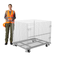 Worker inspecting collapsible wire mesh container in warehouse